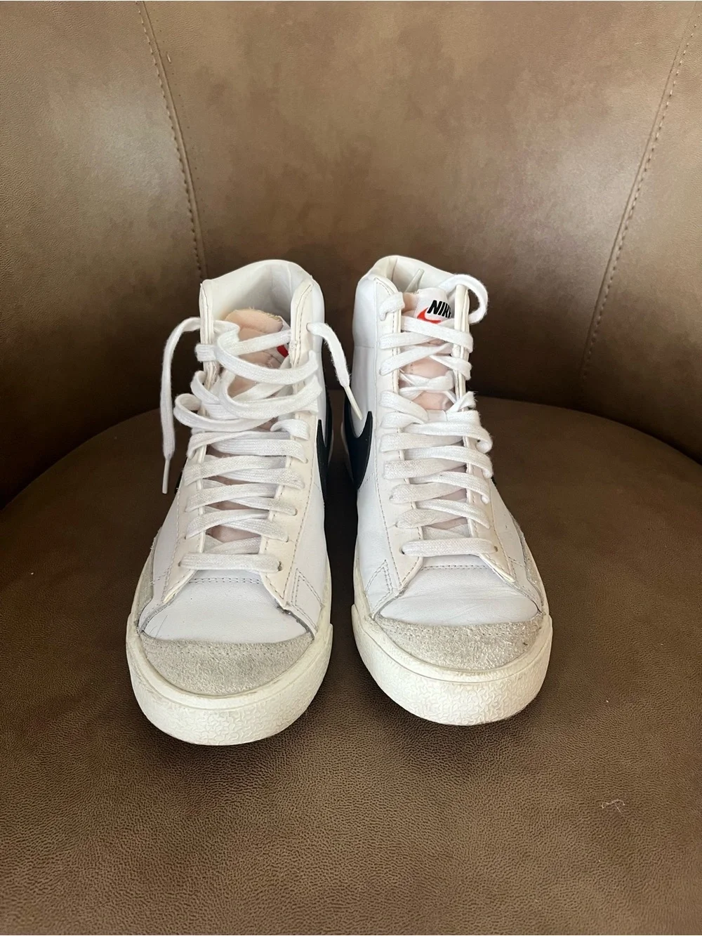 Women’s Nike White High-Top Sneakers with Black Swoosh